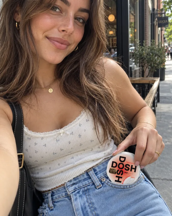 Customer holding a DOSH AirPouch can